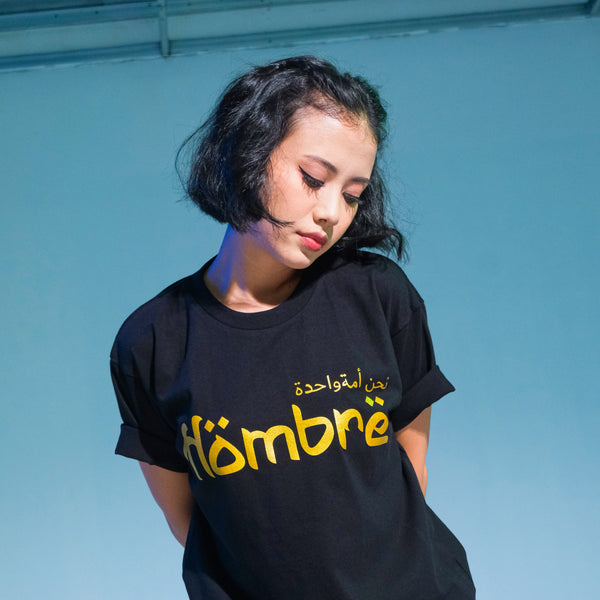 Close-up of Arabic calligraphy print on back of black tee
