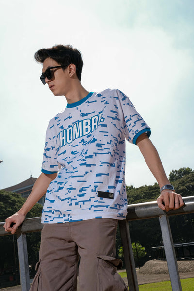 Close-up of pixel-inspired blue graphic print on white tee