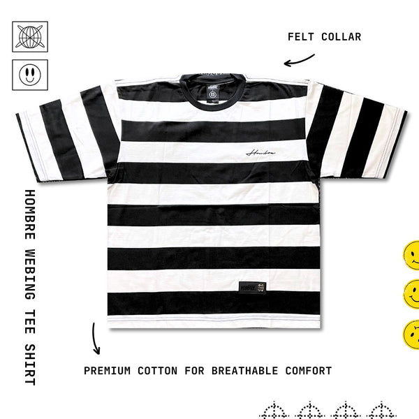 Close-up of Hombre21 logo patch on stripe tee