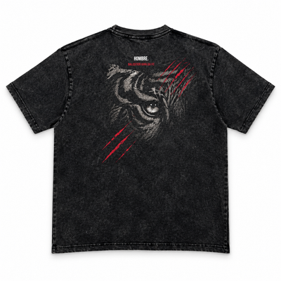 Back of HOMBRE x Balestier Khalsa FC Tiger Instinct washed black tee with large tiger-eye artwork and red claw marks