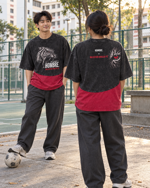 Asian man and woman wearing Tiger Fury oversized washed tees, showing the roaring tiger front and red tiger-eye back artwork
