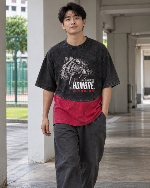 Asian male model wearing the HOMBRE x Balestier Khalsa FC Tiger Fury oversized washed black and red tee